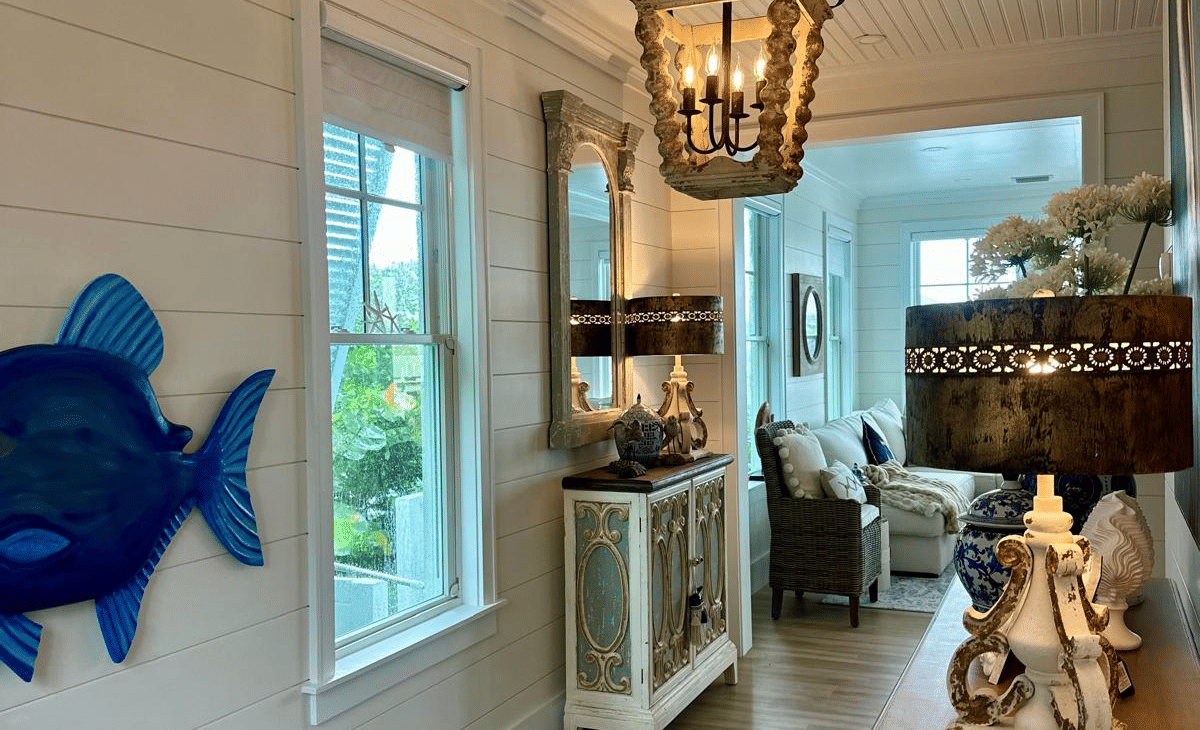 The lobby of Elbow Room Villa 7 in  Abaco inn with large window, ceiling lamp, and wooden furnishing