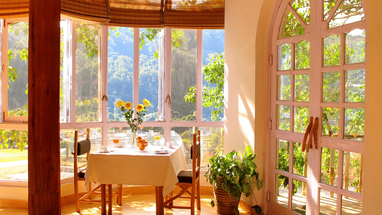 a restaurant setup with table and chair during daytime