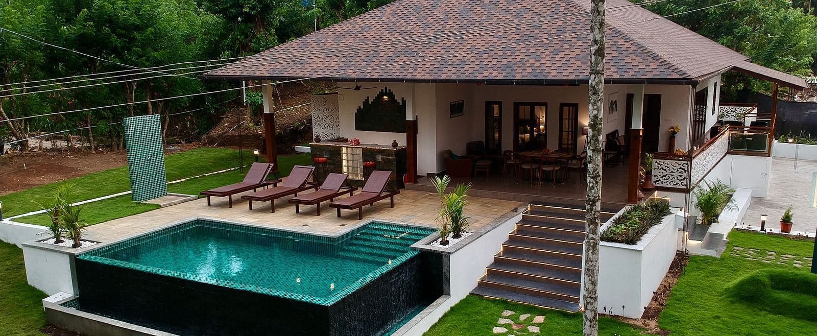 A view of the villa and its private pool, highlighting the outdoor relaxation space - BluSalzz Collection - Tranquil Resort, Wayanad