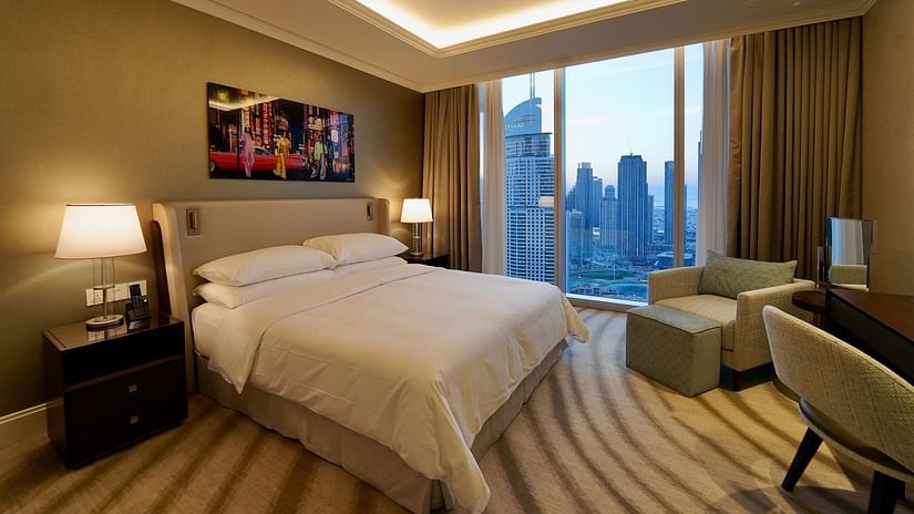 Address Dubai Mal(previously Address Fountain Views Residence Tower - the king size bed kept beside the window that overlooks Burj Khalifa during daytime