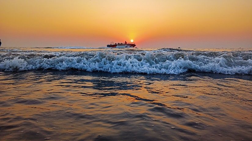 sun setting on the horizon