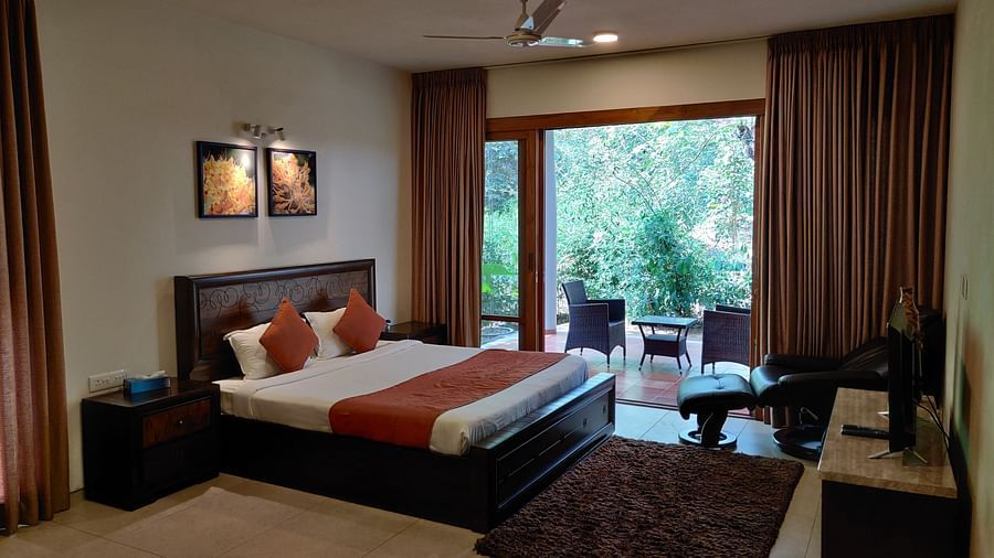 The Birchwood Retreat - bedroom with the view of the garden. 