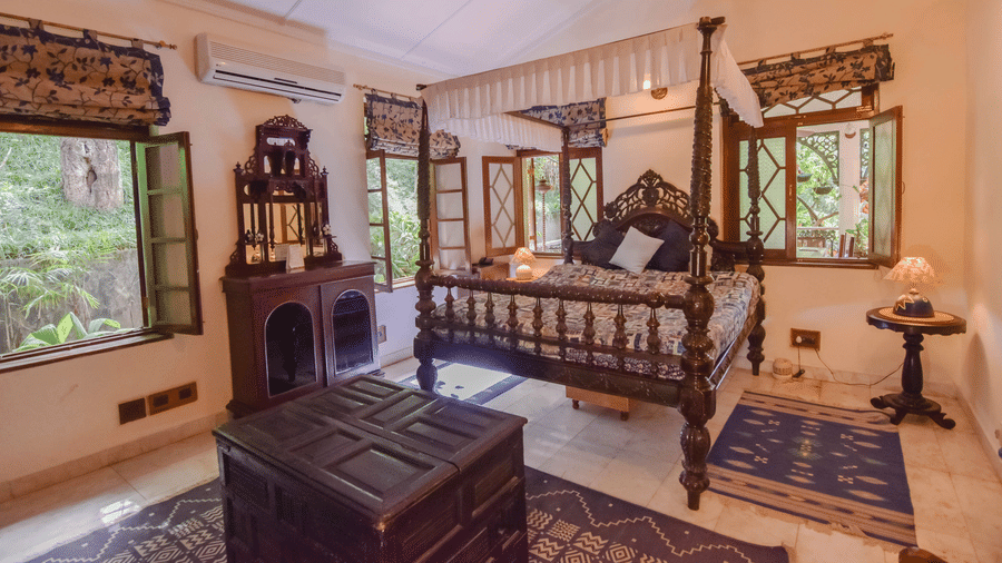 Image of interior of a Hotel Room with bed at Shaheen Bagh Resort Dehradun