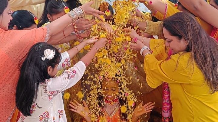 Image of a wedding ceremony with people gathered the bride and groom at The Oriental Residency