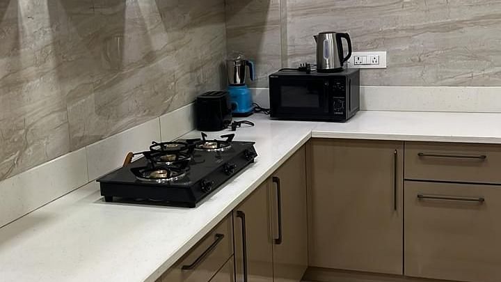 Kitchen area at Lime Tree 3BHK Serviced Apartments, DLF Phase - 5 Gurgaon