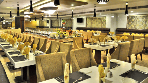 The seating area at Quintessence Restaurant in Chennai - Hotel Raj Park, Chennai