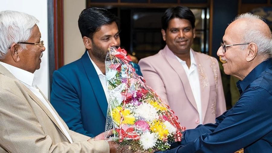 An image of an old man receiving a welcoming bouquet by three other men - Cloud9 Sarovar Premiere, Palolem Goa