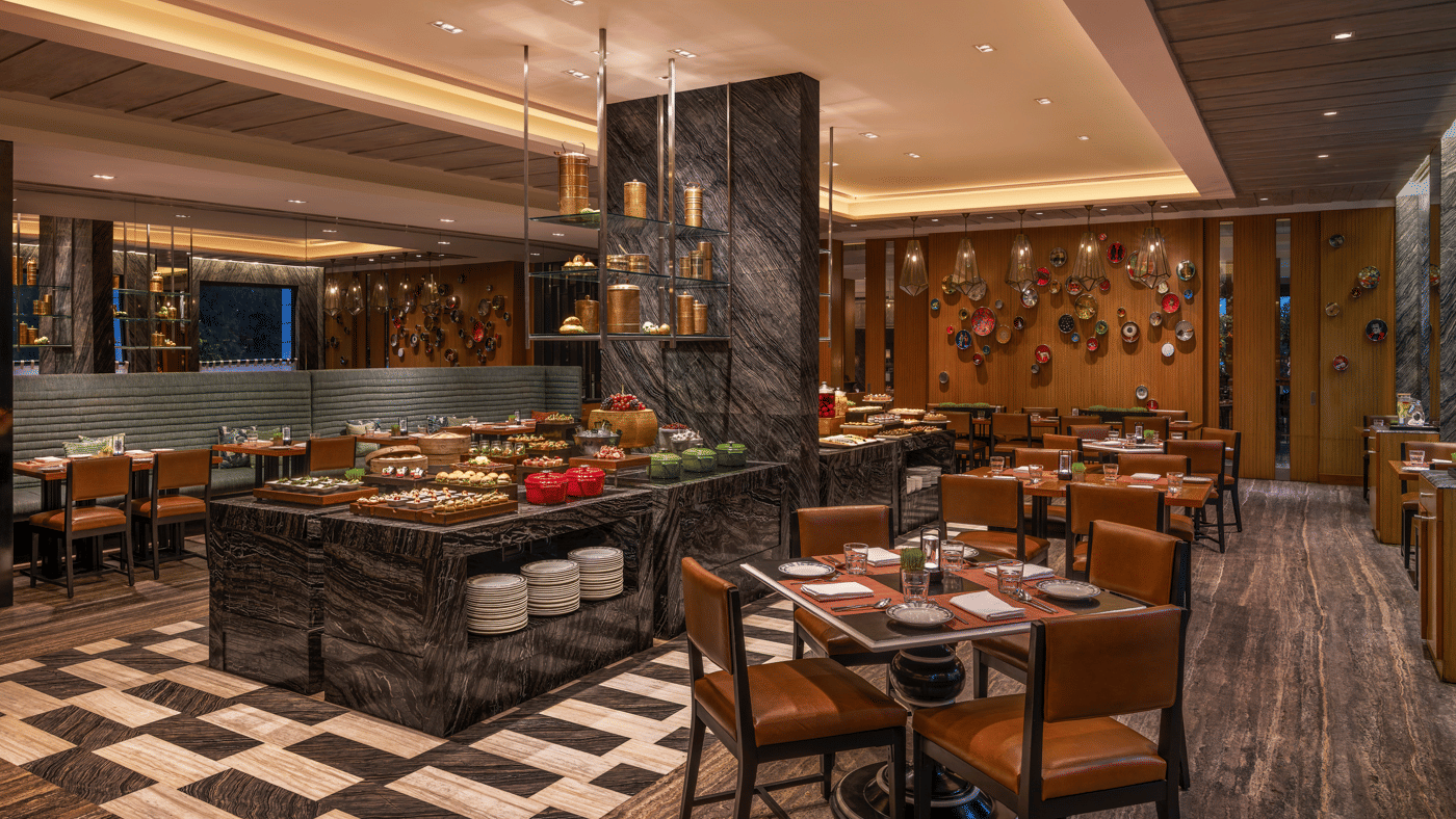 Buffet area with tables, chairs, and food counters at The Raintree, St. Mary’s Road.