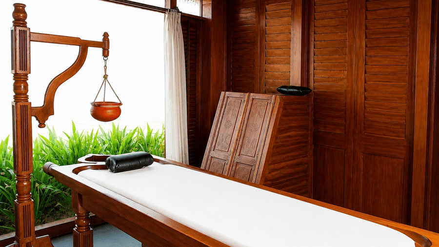Spa massage table setup with warm wooden furnishings and traditional decor at Chariot Beach Resort, designed for a relaxing treatment.