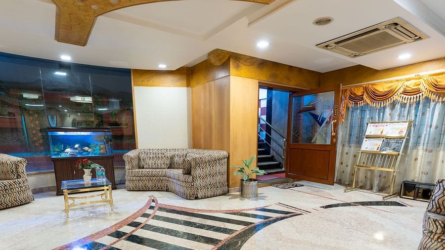 overview of the lobby with seating arrangements inside it - Hotel Pai Comforts, JP Nagar