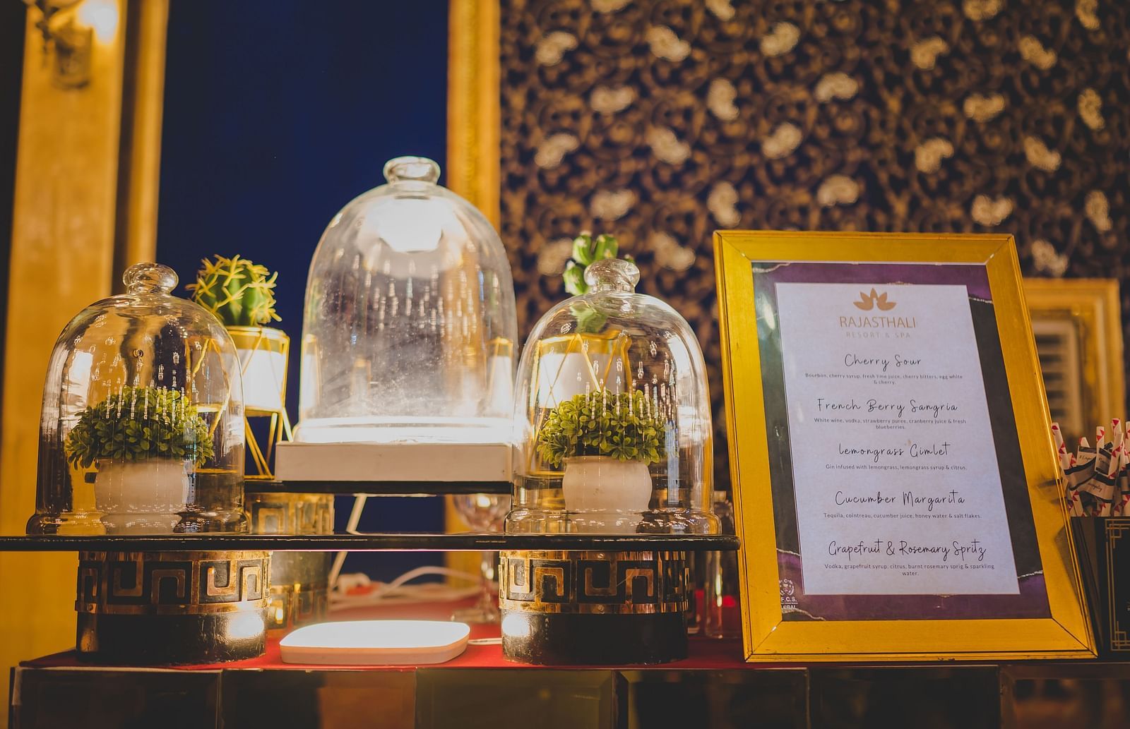 A close up shot of the drinks menu kept on a table with other decorations - Rajasthali Resort & Spa, Jaipur.