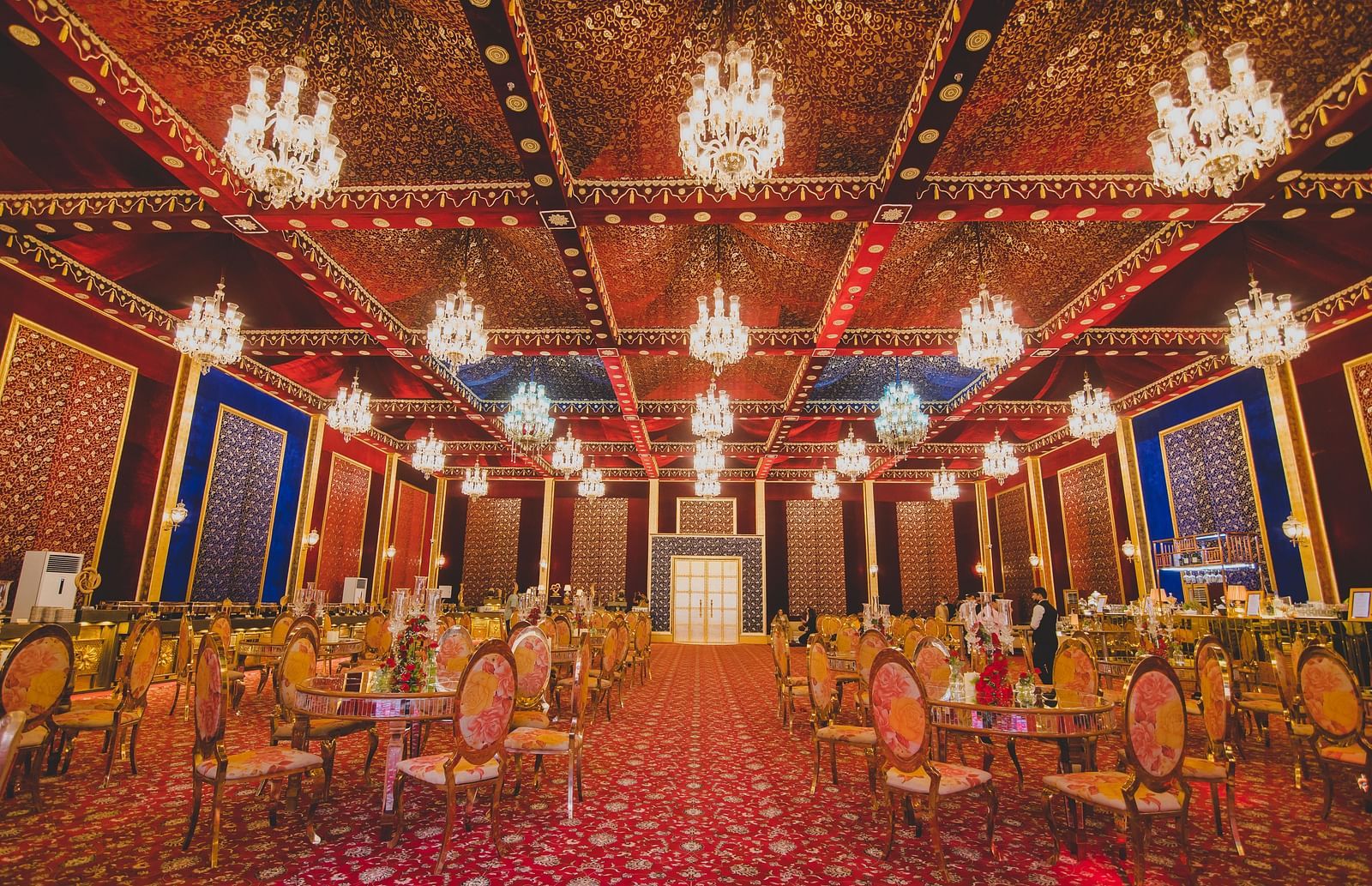An overview of a banquet hall with round table seating arrangement - Rajasthali Resort & Spa, Jaipur.