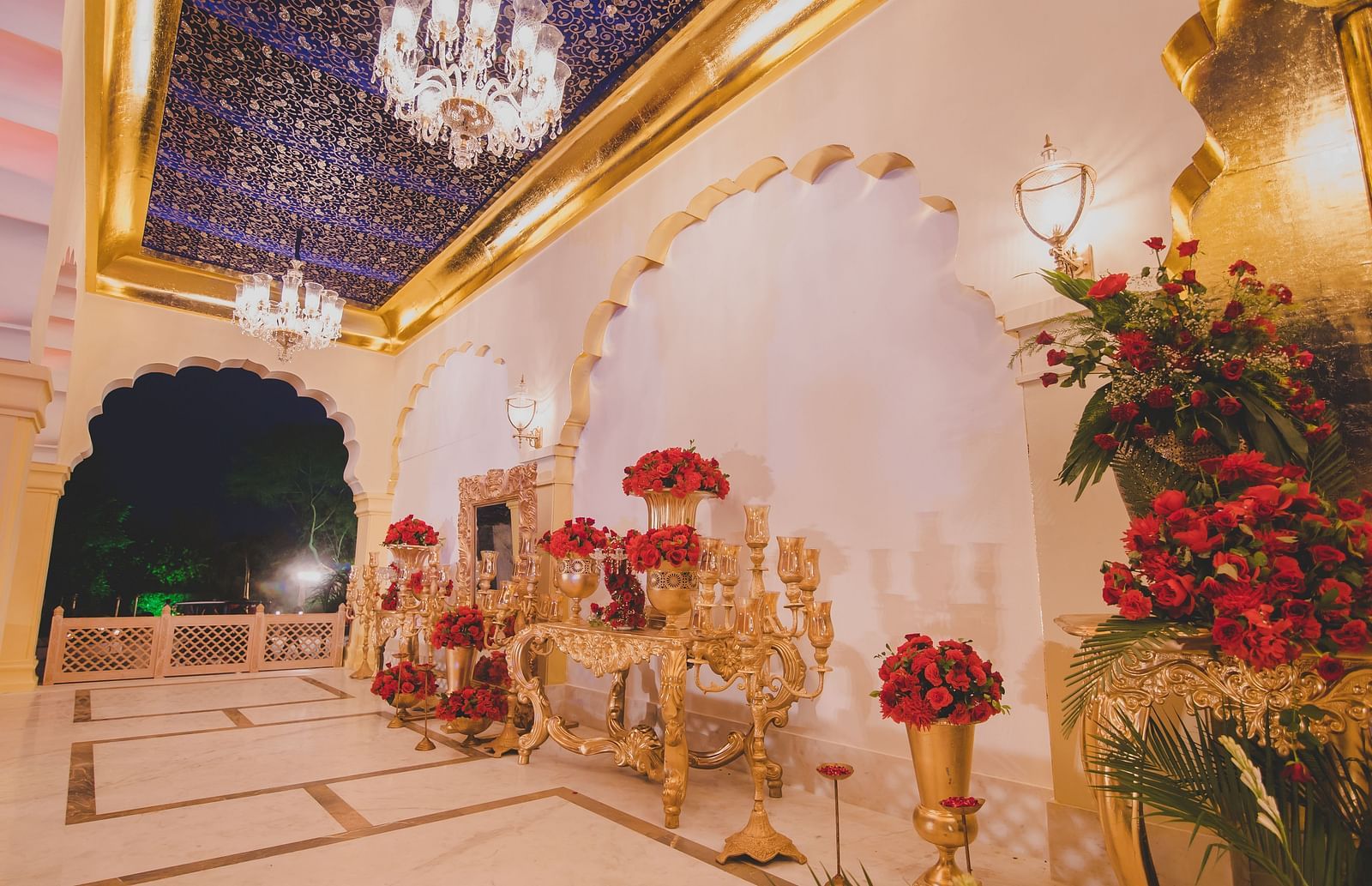 Image of Swarn Mahal with large  vases filled with flowers at Rajasthali Resort & Spa Jaipur.