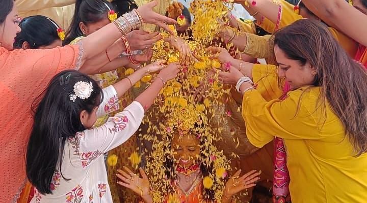 Image of a wedding ceremony with people gathered the bride and groom at The Oriental Residency
