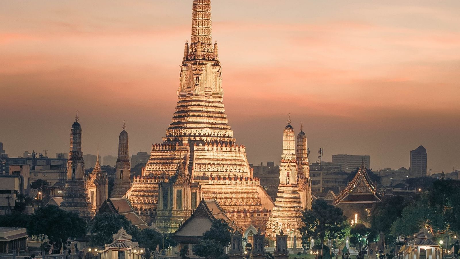 an image showcasing the famous Sunset at Wat Arun with a lake and a boat in front