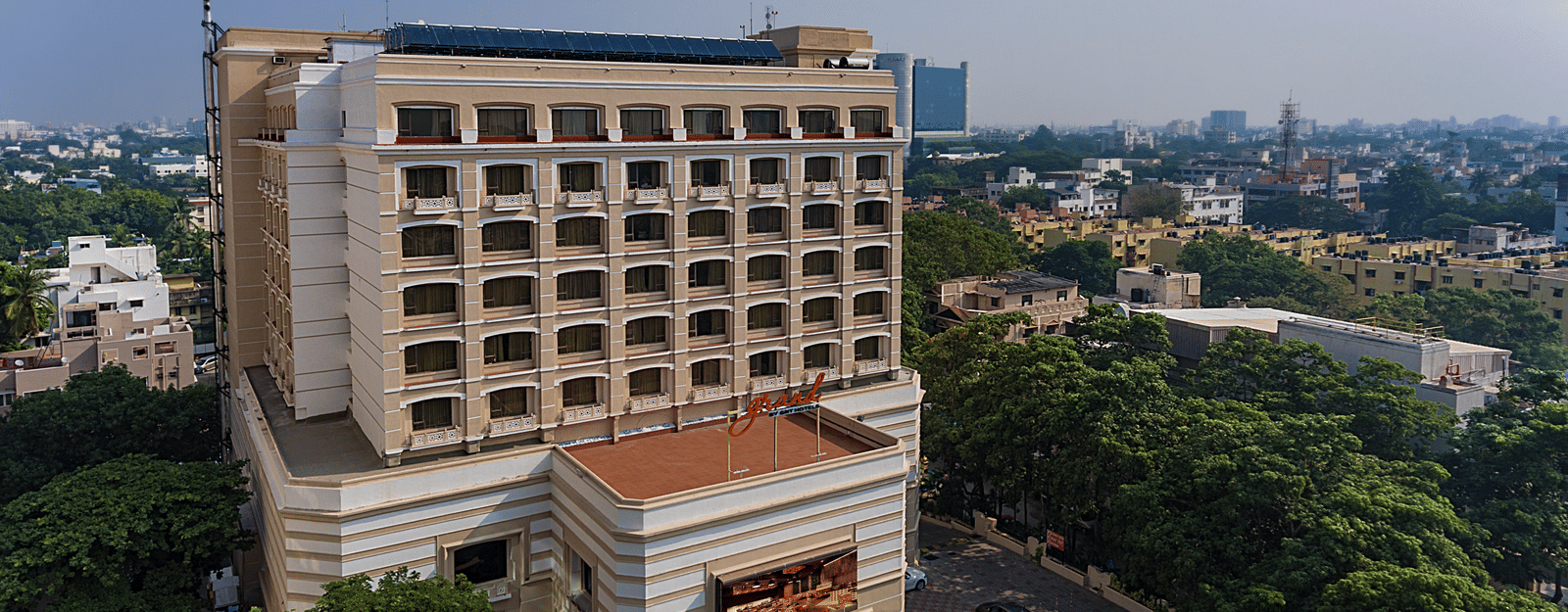Facade view of Grand Chennai By GRT Hotels during day time.