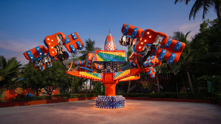 Guests experience the Energy Storm ride at MGM Dizzee World Chennai, soaring through thrilling 360-degree spins on brightly coloured rotating arms for an adrenaline-filled adventure.