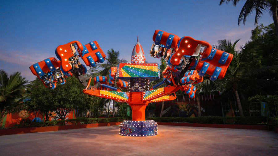 Guests experience the Energy Storm ride at MGM Dizzee World Chennai, soaring through thrilling 360-degree spins on brightly coloured rotating arms for an adrenaline-filled adventure.