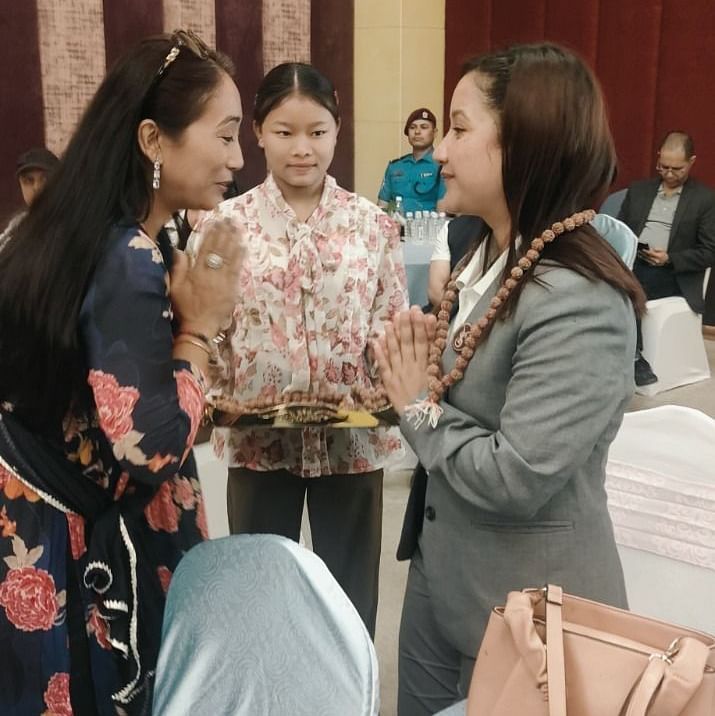 A group of people engaging in conversation at a social gathering