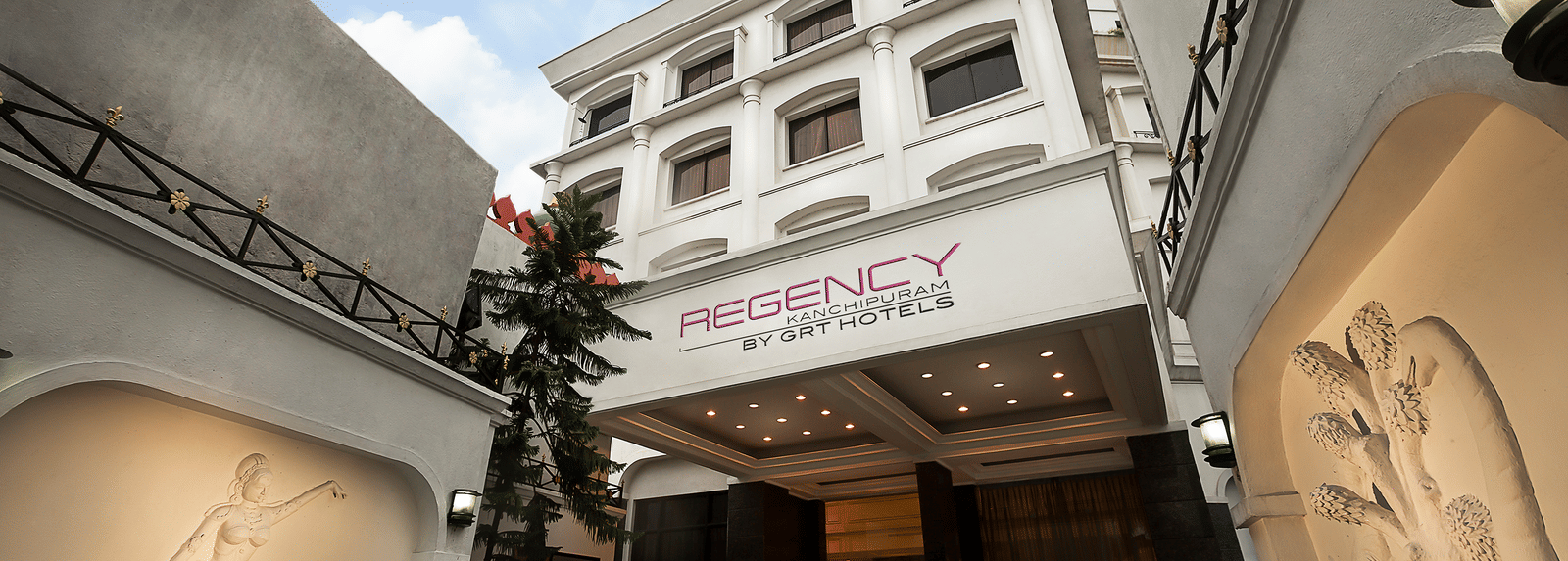 The entrance of hotel in Kanchipuram near Kamakshi Temple with a signboard indicating its name - Regency Kanchipuram By GRT Hotels.