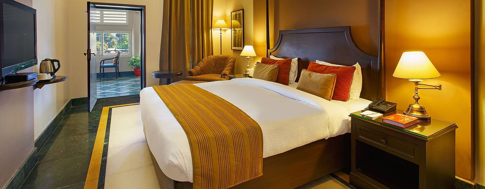 Superior Rooms with side drawers and side lamps and a large bed - Ganga Lahari Haridwar