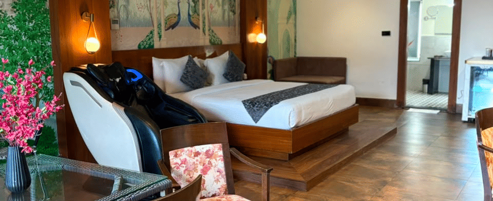 Sky Suite, Dressing table and lounge chairs beside the bed