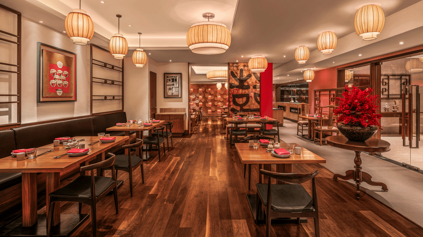 Indoor restaurant with wooden flooring and dining tables at The Raintree, St. Mary’s Road.