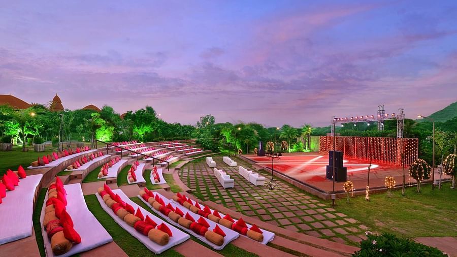 An overview of rangbhoomi amphitheatre with seating arrangements, lighting and speakers - The Ananta Udaipur