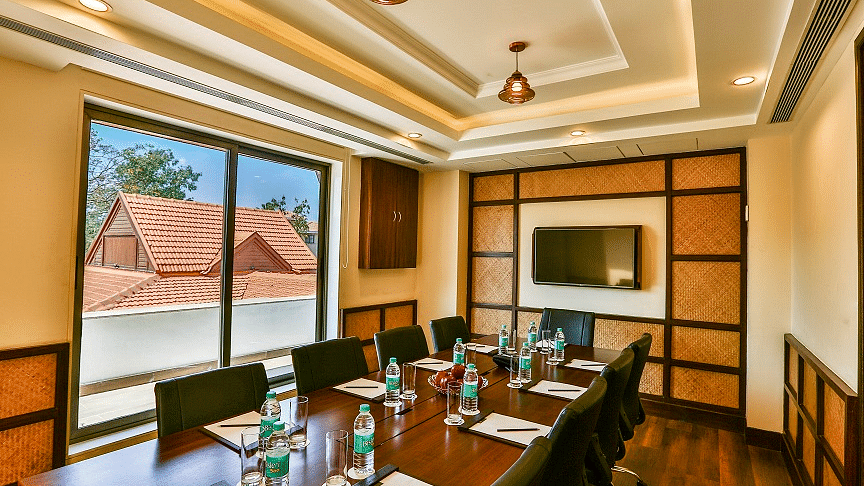 an image of the well-appointed interiors of a conference hall in Lonavala - Rhythm Lonavala.