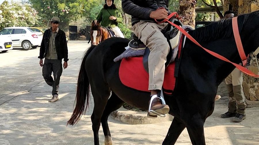 An image of a man riding a horse - Utsav Camp Sariska