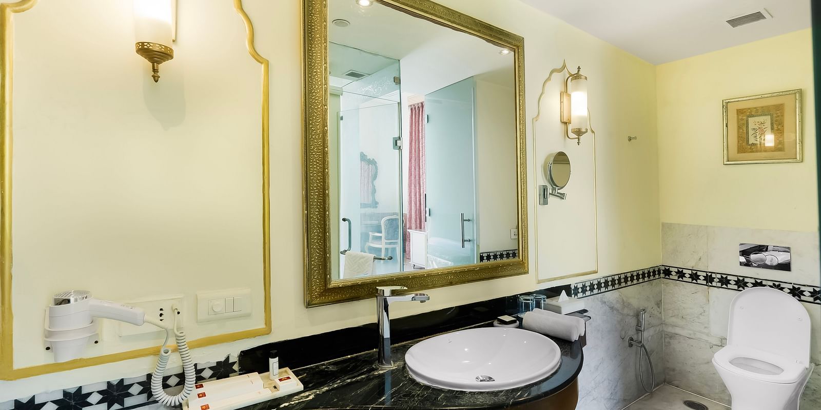 An overview of a bathroom inside one of the room with sink area in view - Rajasthali Resort & Spa, Jaipur.