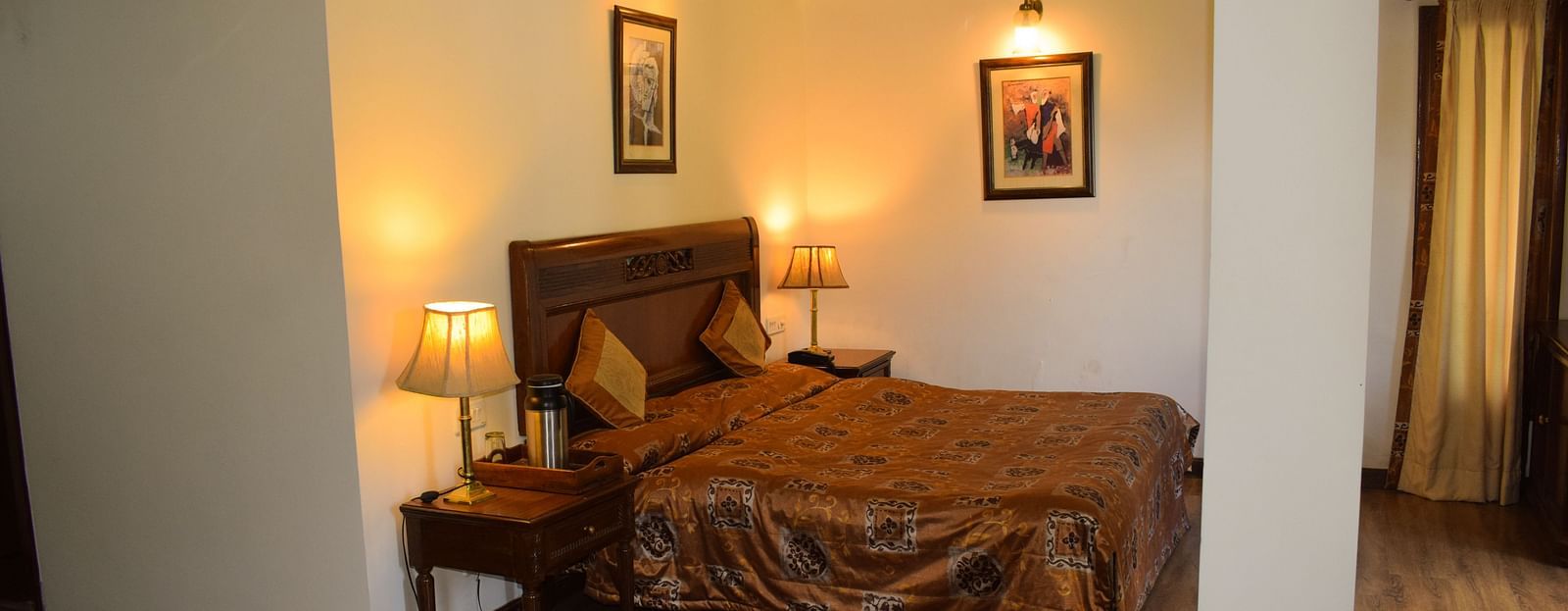 Image featuring  interiors of a Suite room with with the wooden flooring - Sun n Snow Inn, Kausani