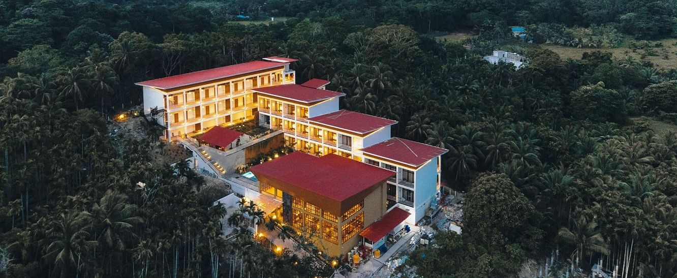 Panoramic aerial view of the Sea Hills Hotels & Resorts, showcasing the property surrounded by lush greenery and tropical landscape - Sea Hills Resort, Swaraj Dweep (Havelock)