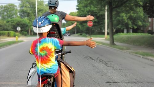 A family cycling in empty roads