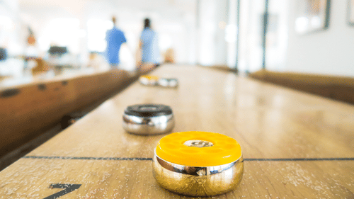 abacus scoring game with metal pucks over the 2 line