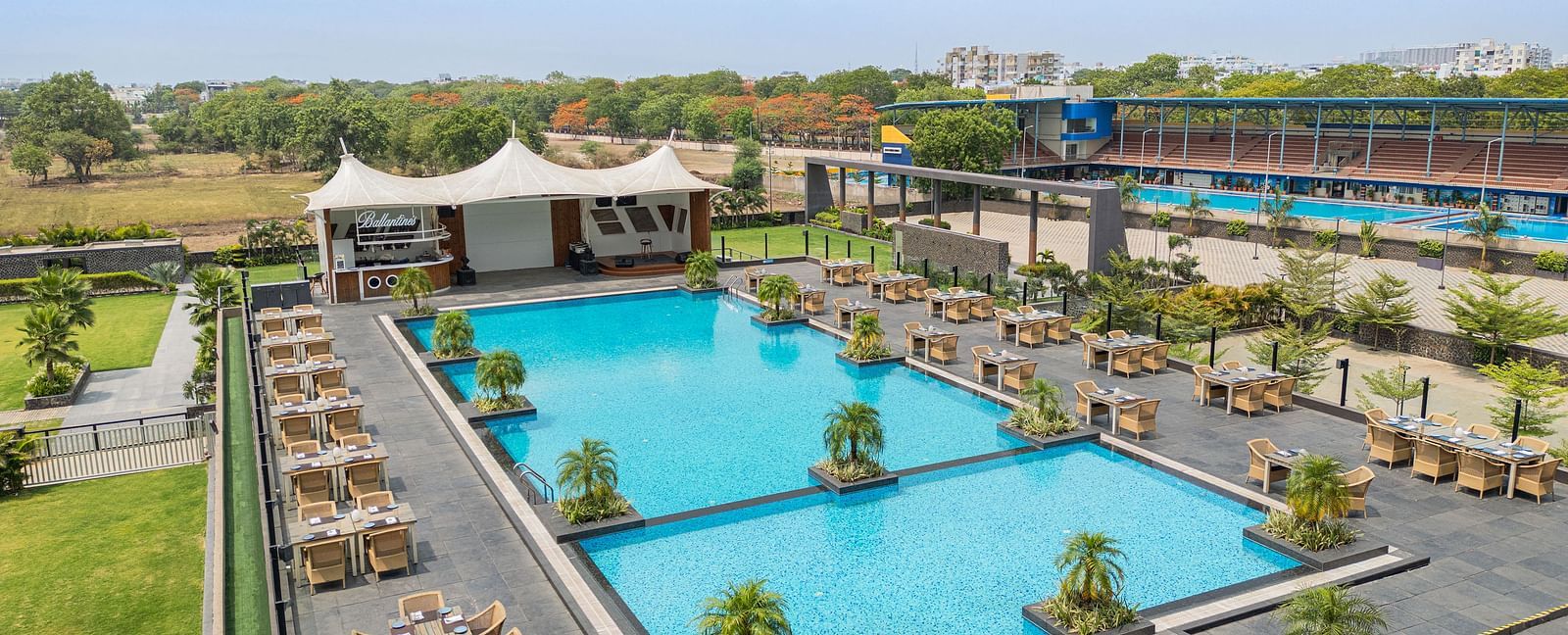 Aerial view of outdoor swimming pool at Essentia Luxury Hotel, Indore.