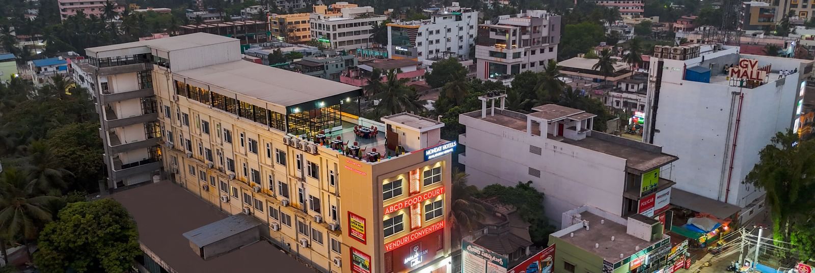 City skyline featuring aerial view of Monday Hotels Amalapuram Heights.