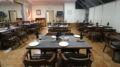 another view of the seating arrangements inside a restaurant - VITS Kamats Resort, Silvassa