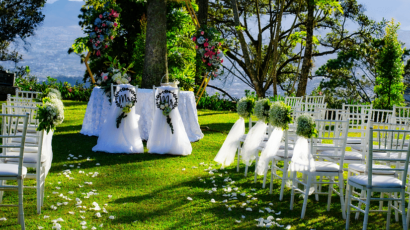 Wedding arrangements in the lawn area, featuring chairs and decorations arranged aesthetically.