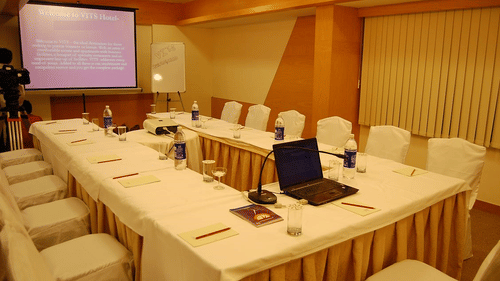 an overview of Coral Hall with rectangle style seating arrangement