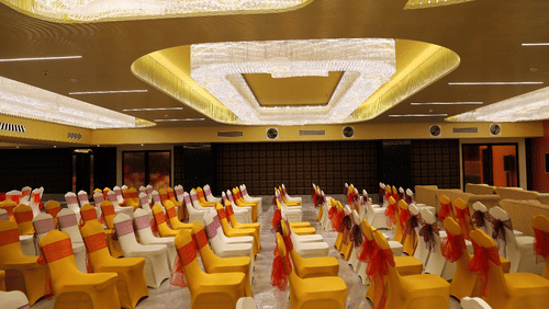 Theatre style seating arrangements inside the banquet hall with modern lights on the ceiling - VITS Bharat Nanded
