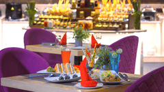 A restaurant featuring a bunch of chairs and tables - Royale Sarovar Portico, Agra