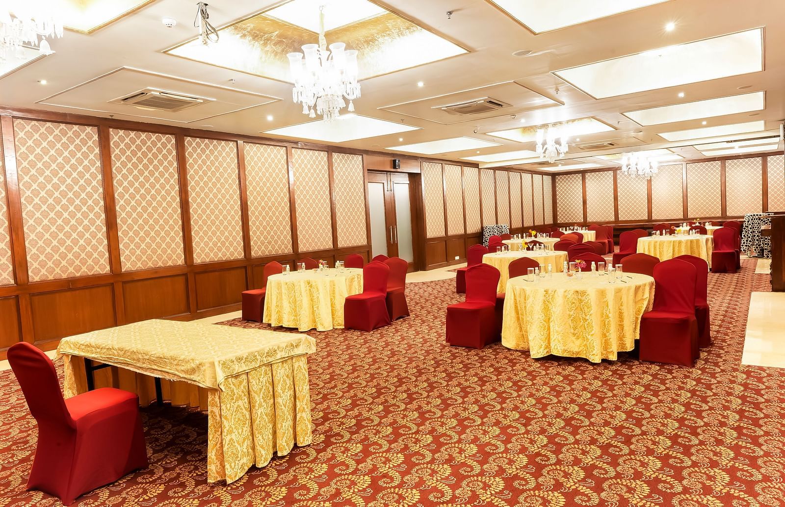 An overview of a banquet hall with round table seating - Rajasthali Resort & Spa, Jaipur.