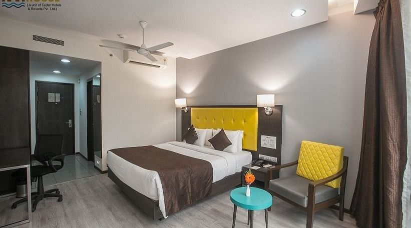 Premium Room with a double bed and work desk and chair at Hotel Mumbai House, Airoli