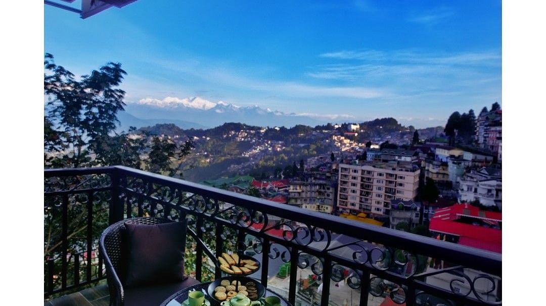 Shot of the private balcony overlooking the surroundings with chairs and table.