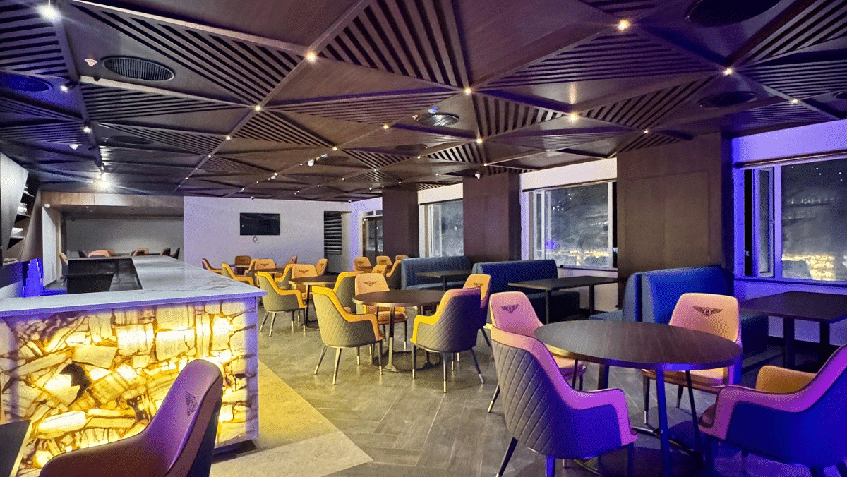 Image of Crown Bar with seating area and wooden ceiling at Le Royale Palace.