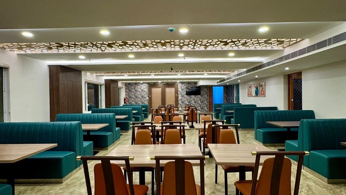 Image of a dining space with chairs and sofas at Le Royale Palace.
