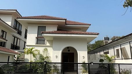 A grand residential villa with a black gate, arched entrance, and a modern architectural design - BluSalzz Villas - Alocassia, Anjuna.