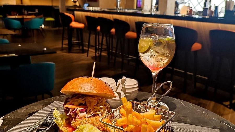burger served with fries and a drink