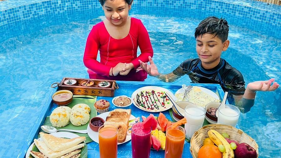 people having breakfast in pool at Themis Mudhouse - A Nature's Retreat Resort & Wellness
